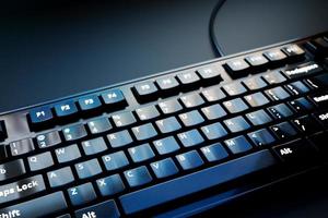 3d illustration, close up of the realistic computer or laptop keyboard  on black background .  Gaming keyboard with LED backlit photo