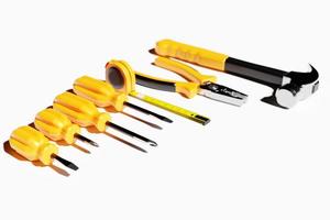 3D illustration of a metal hammer with a yellow handle, screwdrivers, pliers, hand tools isolated on a white background. 3D render and illustration of repair and installation tool photo