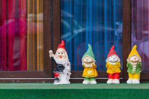 Close-up company of colorful decorative gnomes for the garden photo