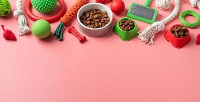 Pet care concept, various pet accessories and tools on pink background, flat lay photo