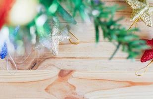 Christmas tree and star on the wooden background photo