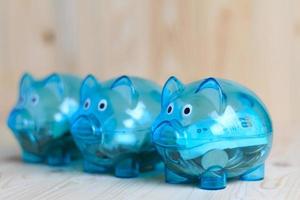 Clear piggy bank with 3 pigs photo