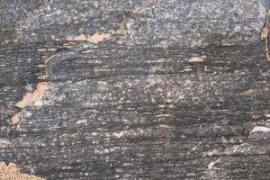 Abstract background and texture of stone with hit the sea water photo