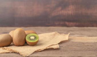 Kiwi fruits or Actinidia chinensis and a half on the sack