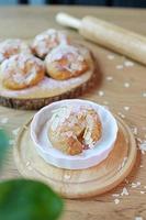 croissant on ceramic plate on wood table photo
