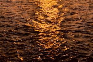 sun reflections in the sea photo