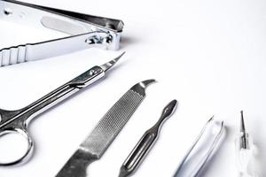 Tools for manicure and nail care on white background. photo