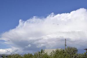 Heavy thundery blue clouds with rain and storm photo