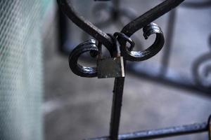 Iron lock on steel cages of doors and windows photo