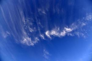 Evening sunset sky with blue and yellow clouds photo