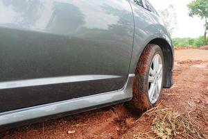 Car mired. Rainy season, soil will have moisture, causing the car to mired. photo
