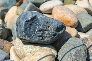 Beautiful river stones outdoors under the sun photo