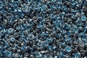 Bolts and screws with hats for fixing various elements including computer components photo