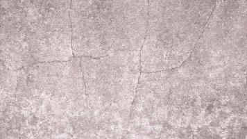 The old cement wall was weathered, the surface was scratched, the surface was scratched and damaged. For a mysterious retro-conservative background. photo