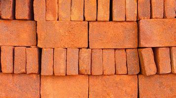 Closeup view of red bricks as building materials photo