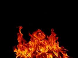 Flame meat that burns from a furnace or from cooking. dangerous feeling abstract black background .Suitable for banners or advertisements photo