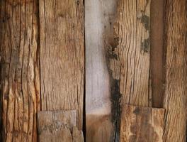An old wooden plank table with a mottled surface and a pattern. photo