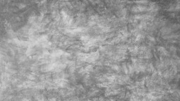 The old cement wall was weathered, the surface was scratched, the surface was scratched and damaged. For a mysterious retro-conservative background. photo