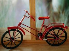 First hand-made model of bicycle with bokeh background. photo