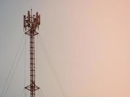 Telephone towers used to broadcast signals at dusk. photo