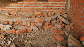 Close-up of the rubble of an industrial building collapsing into a pile of concrete and brick. and the jagged debris caused by the failure of the engineers at the abandoned construction. photo