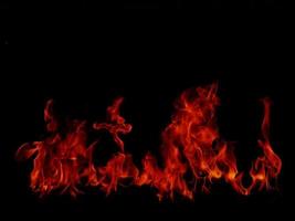 Flame Flame Texture For Strange Shape Fire Background Flame meat that is burned from the stove or from cooking. danger feeling abstract black background Suitable for banners or advertisements. photo