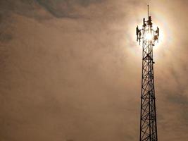 Telephone towers used to broadcast signals at dusk. photo