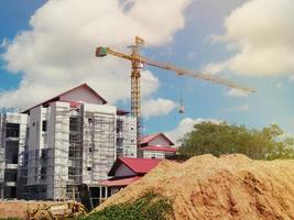 The building under construction overlooking the sky and clouds. photo