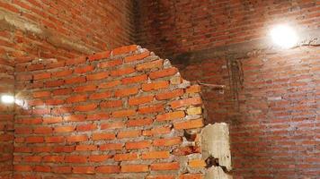 Unconventional building site The masonry was neglected, irresponsible, not progressing, only half finished. Some parts, the walls had rough surfaces. photo