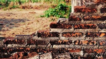 Close-up of the rubble of an industrial building collapsing into a pile of concrete and brick. and the jagged debris caused by the failure of the engineers at the abandoned construction. photo