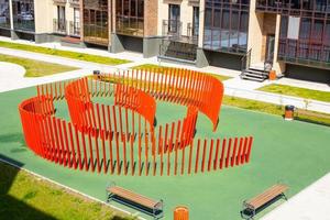 Red design for games on the playground. Wooden building. photo