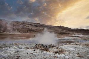Scenic view of steaming fumarole in geothermal area of Hverir at Namafjall photo
