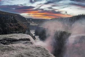 Beautiful Gullfoss waterfall in Golden Circle against cloudy sky during sunset photo