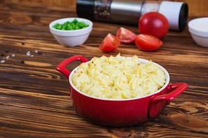 Homemade shepherd's pie on wooden background photo