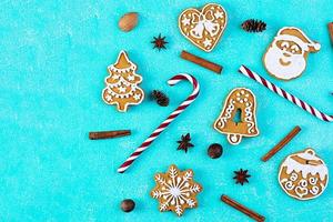 Christmas homemade gingerbread cookies on blue background. Top view photo