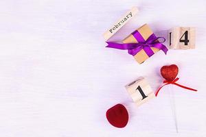 Valentine day. Wooden calendar with February 14 on it. photo