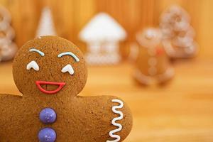 Christmas gingerbread cookies on wooden background photo