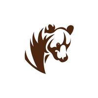 un símbolo de silueta abstracta de un oso en color marrón