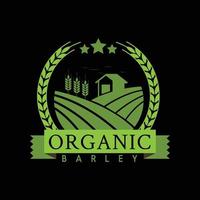 an emblem logo for organic farming product or company depicting a barn in the middle of a wheat or barley field all in green color on dark ground vector