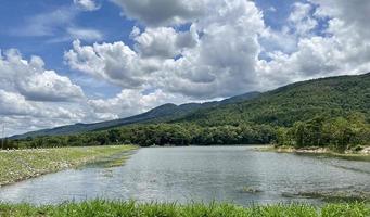 View of dam with mountain and blue sky photo