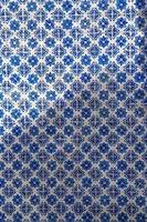 Traditional geometric decorative tile in Portugal photo