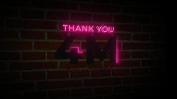 merci 4m followers enseigne lumineuse au néon réaliste sur l'animation du mur de briques video