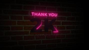 obrigado 2k seguidores sinal de brilho de néon realista na animação da parede de tijolos video