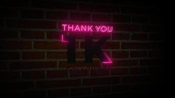 Thank you 1K followers realistic neon glow sign on the brick wall animation video