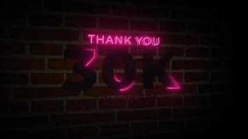 merci 30k followers enseigne lumineuse au néon réaliste sur l'animation du mur de briques video