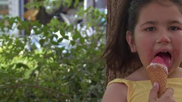 Little Girl Looking at Camera While Eating Ice Cream video