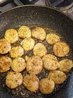 Fried scallops with butter and garlic sauce photo