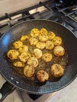 Fried scallops with butter and garlic sauce photo