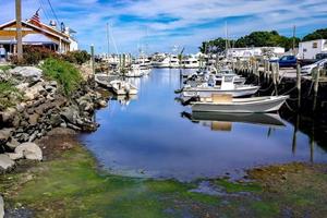 Small boats lining waterfront in Wickford Cove photo