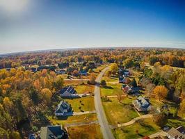 aerial view of colorful trees in a neighborhood before sunset photo